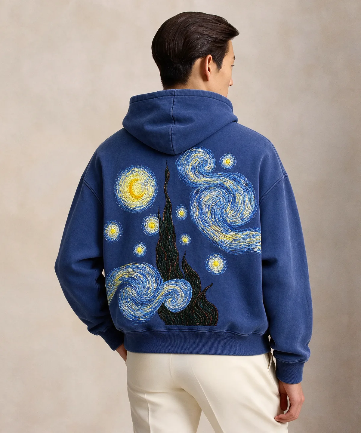 The Starry Night hoodie worn, back: the full Starry Night embroidered across washed indigo
